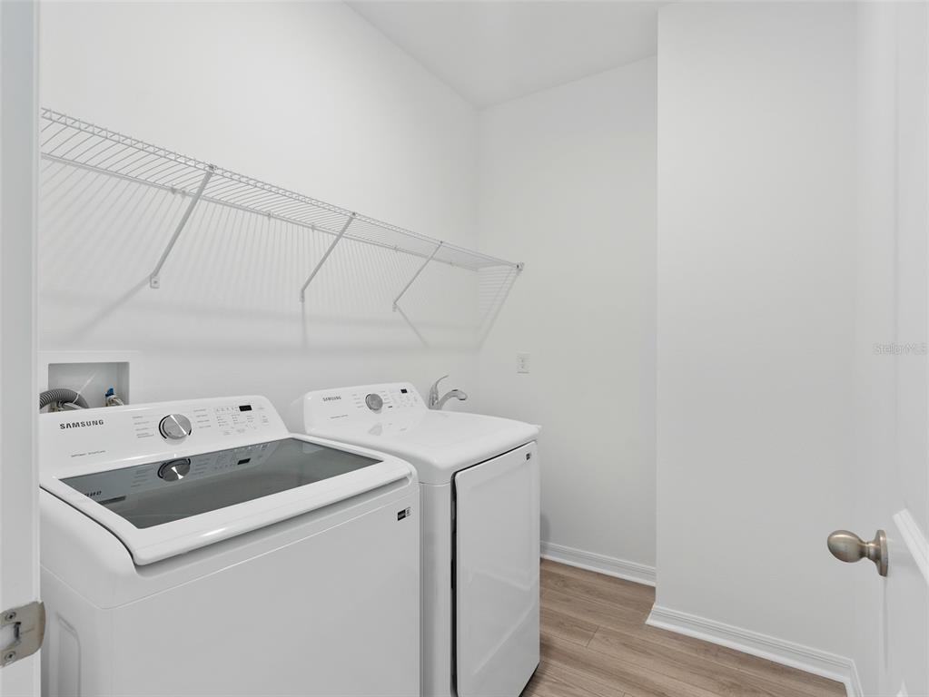 1122 Pearl Tree Road Deltona, FL 32725 - Photo 24 of 30 a utility room with dryer and washer