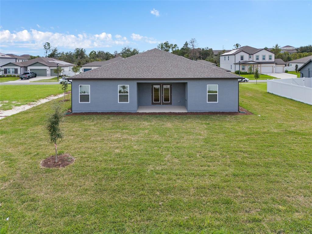 1122 Pearl Tree Road Deltona, FL 32725 - Photo 30 of 30 a front view of a house with a yard