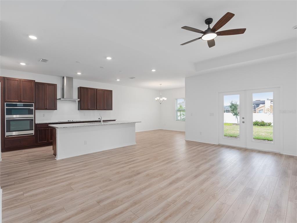 1122 Pearl Tree Road Deltona, FL 32725 - Photo 4 of 30 a view of kitchen with cabinets and wooden floor