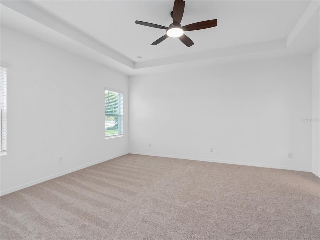 1122 Pearl Tree Road Deltona, FL 32725 - Photo 9 of 30 an empty room with a window and a fan