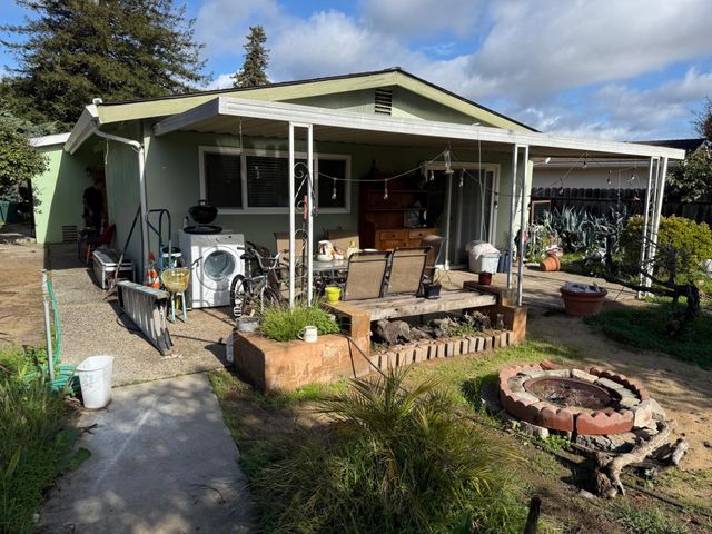 a view of backyard with green space
