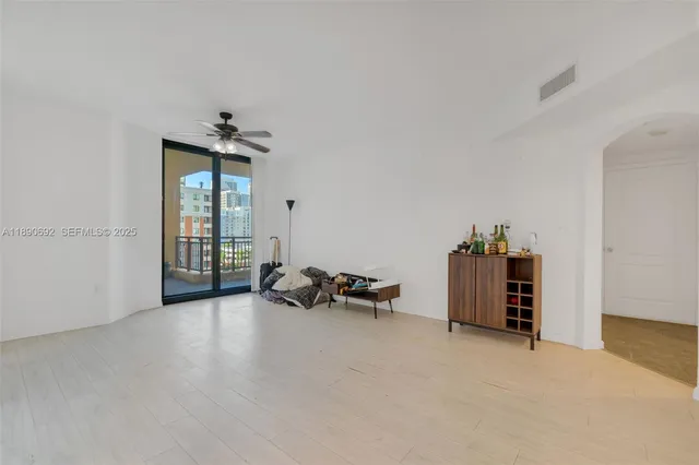 an empty room with a empty space and windows