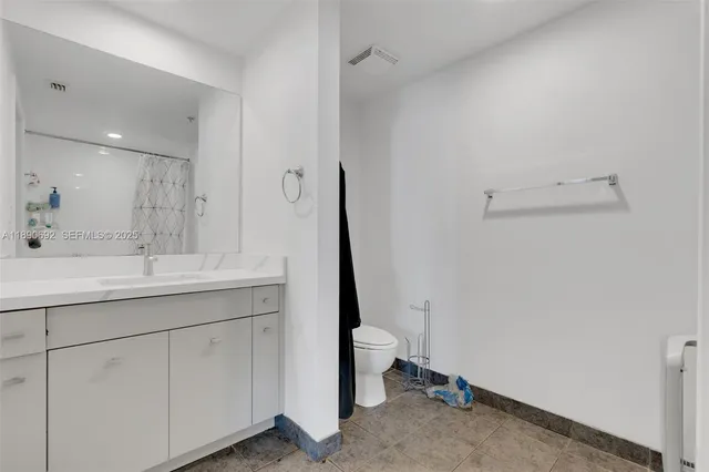 a view of workspace with wooden floor and gym equipment