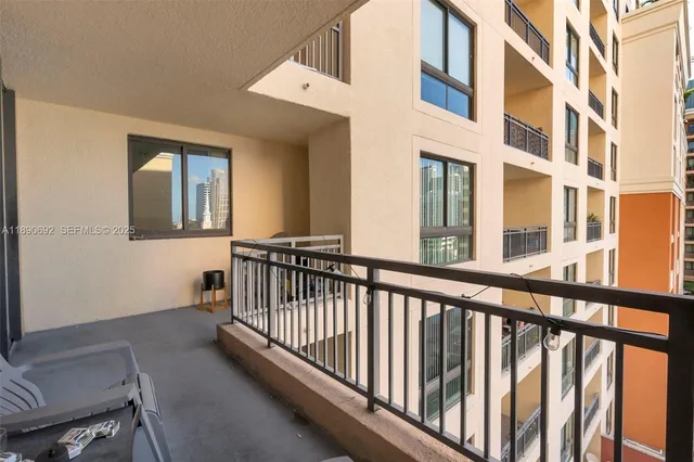 a view of a patio with table and chairs and potted plants