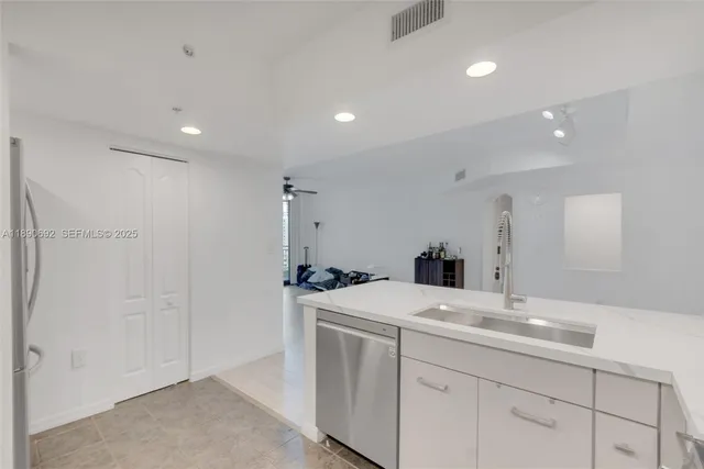 a view of a kitchen with a sink
