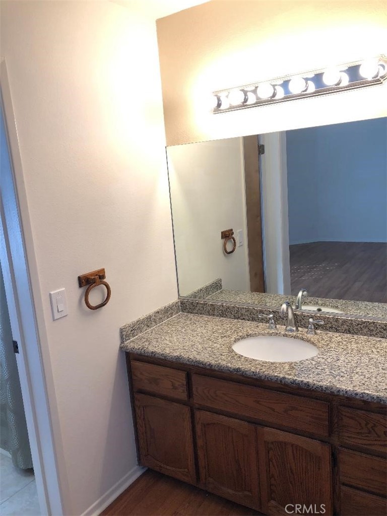 2248 Del Mar Road, Unit 3 Montrose, CA 91020 - Photo 8 of 12 a bathroom with a granite countertop sink and mirror