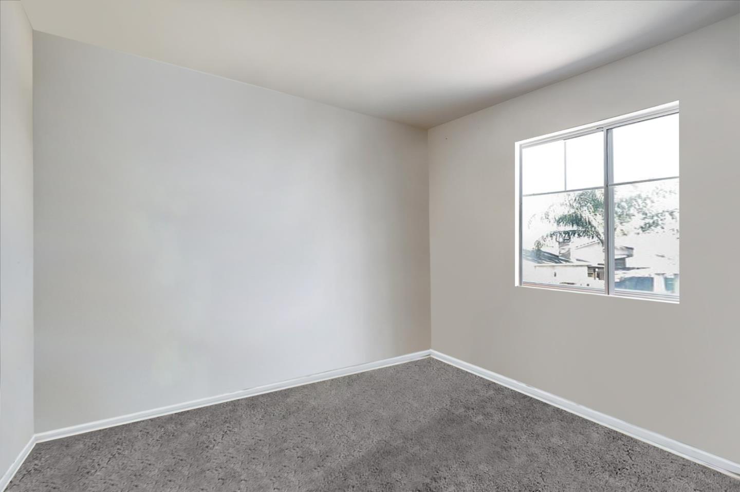 2113 Manhattan Way Modesto, CA 95358 - Photo 12 of 17 an empty room with windows