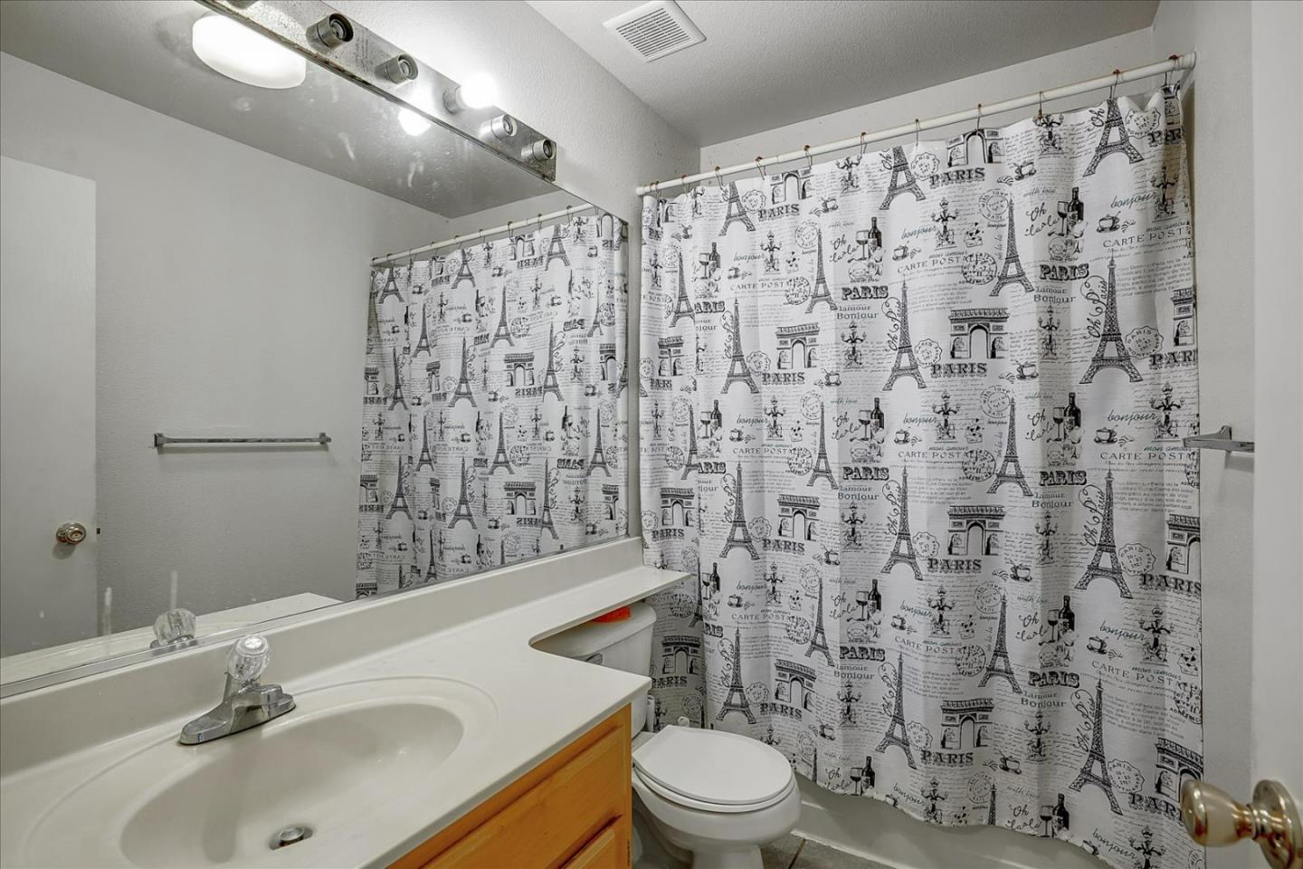 2113 Manhattan Way Modesto, CA 95358 - Photo 17 of 17 a bathroom with a sink toilet and shower