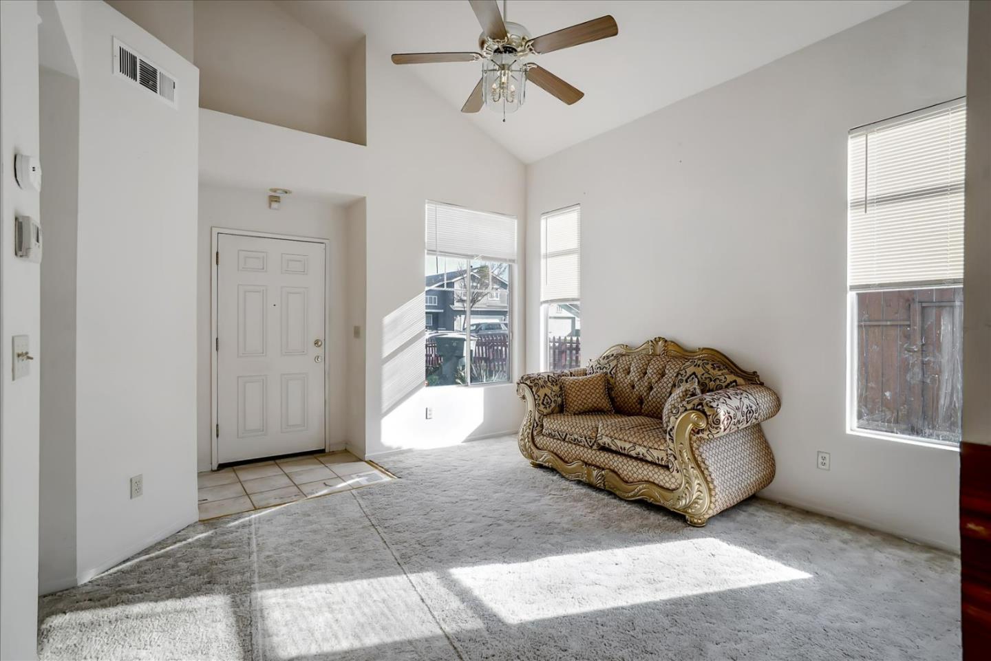 2113 Manhattan Way Modesto, CA 95358 - Photo 3 of 17 a living room with furniture and a window