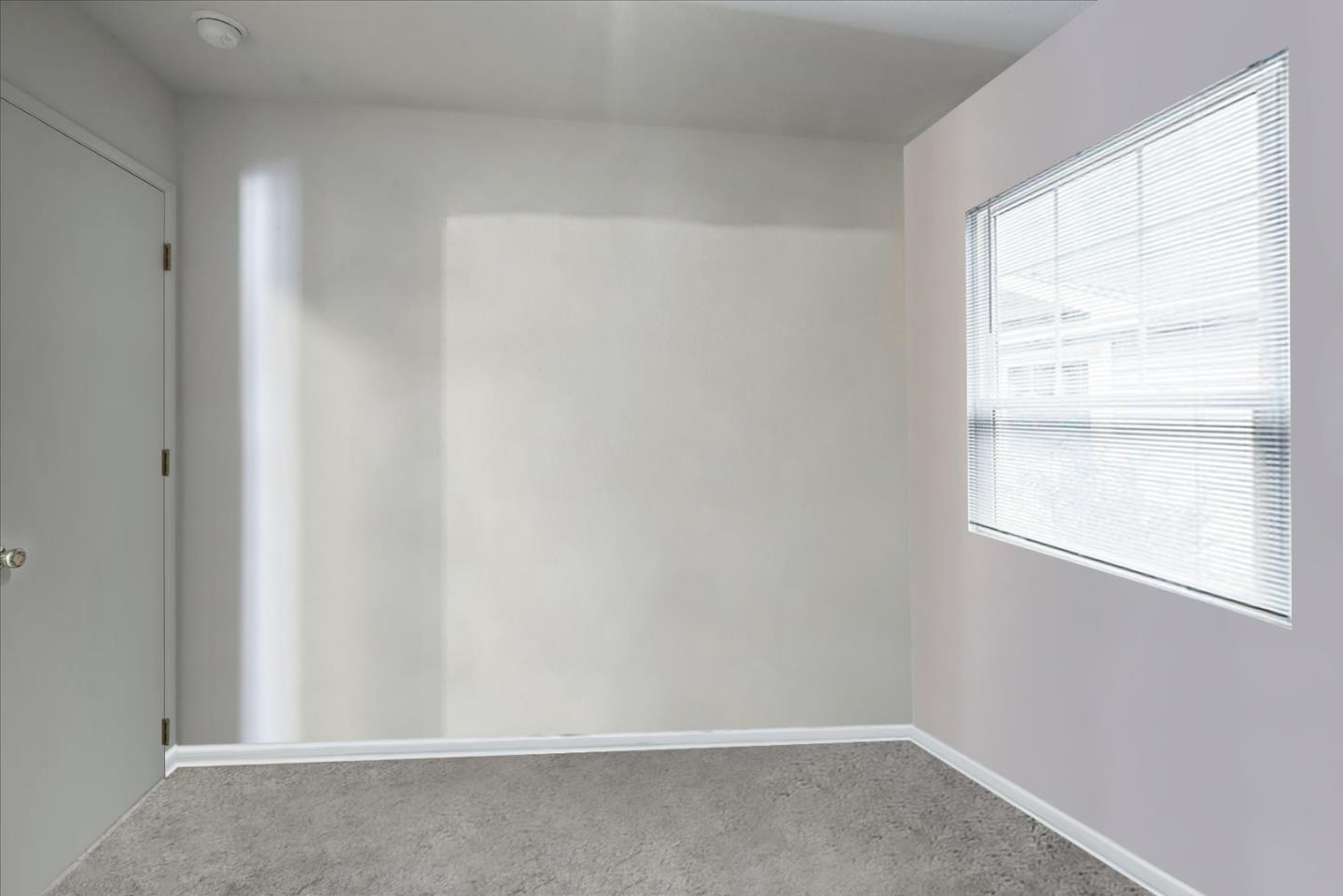 2113 Manhattan Way Modesto, CA 95358 - Photo 10 of 17 a view of an empty room with a window