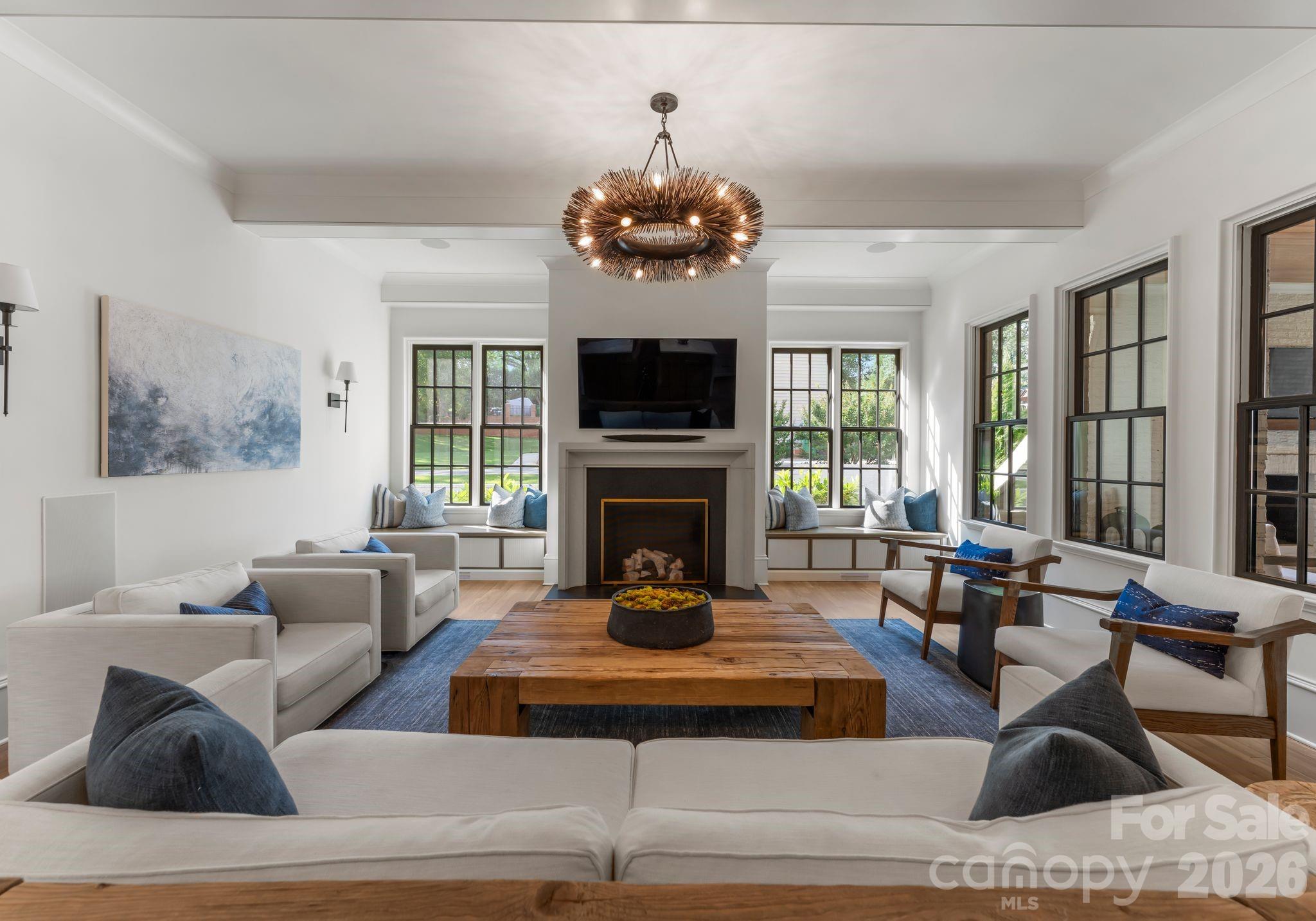 5625 Timber Lane Charlotte, NC 28270 - Photo 11 of 48 a living room with furniture a large window and a fireplace