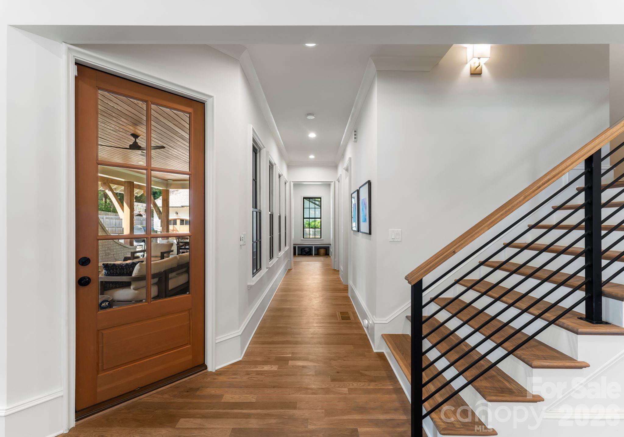 5625 Timber Lane Charlotte, NC 28270 - Photo 12 of 48 a view of a hallway with wooden floor and staircase