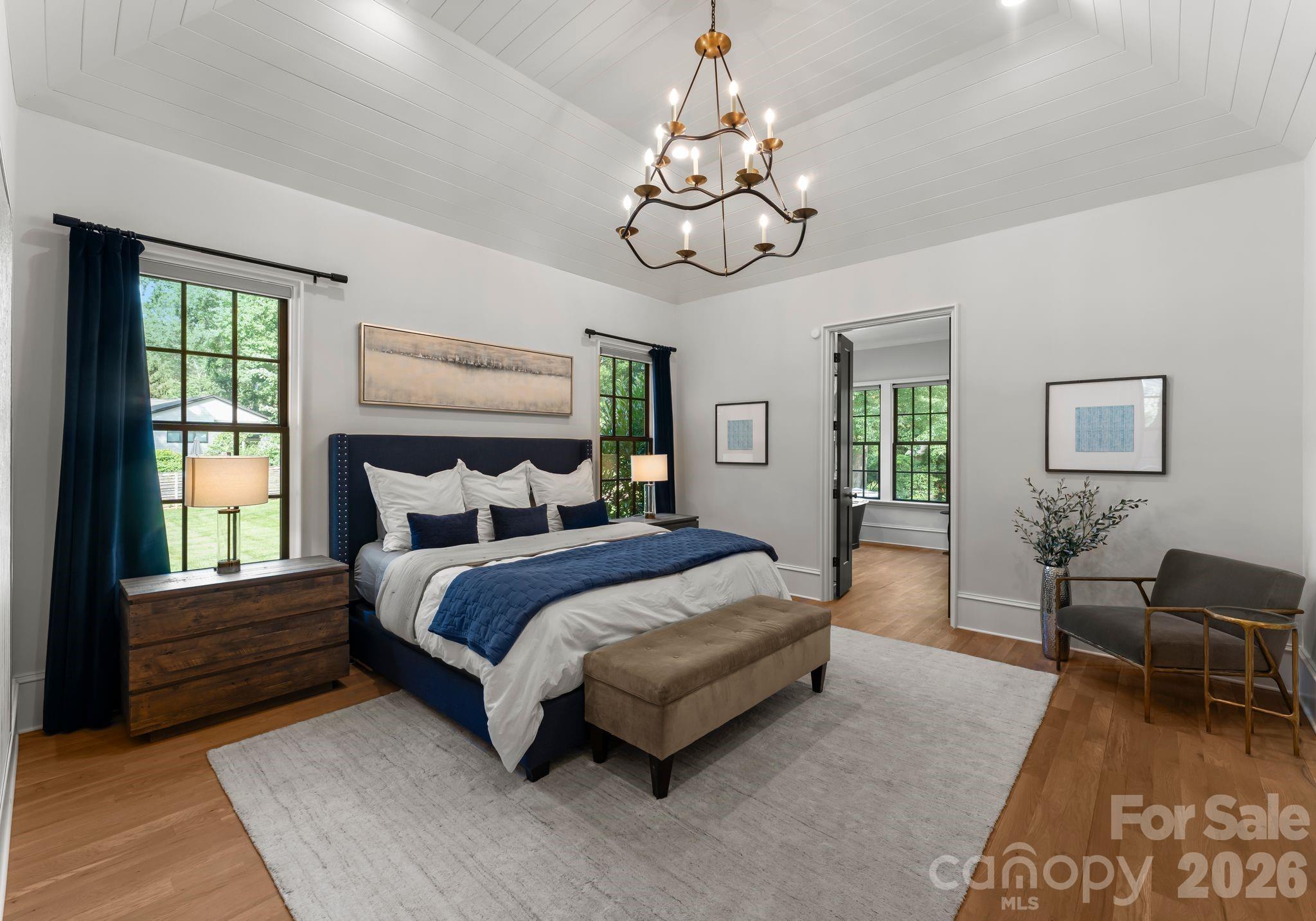5625 Timber Lane Charlotte, NC 28270 - Photo 15 of 48 a spacious bedroom with a bed a couch and dresser