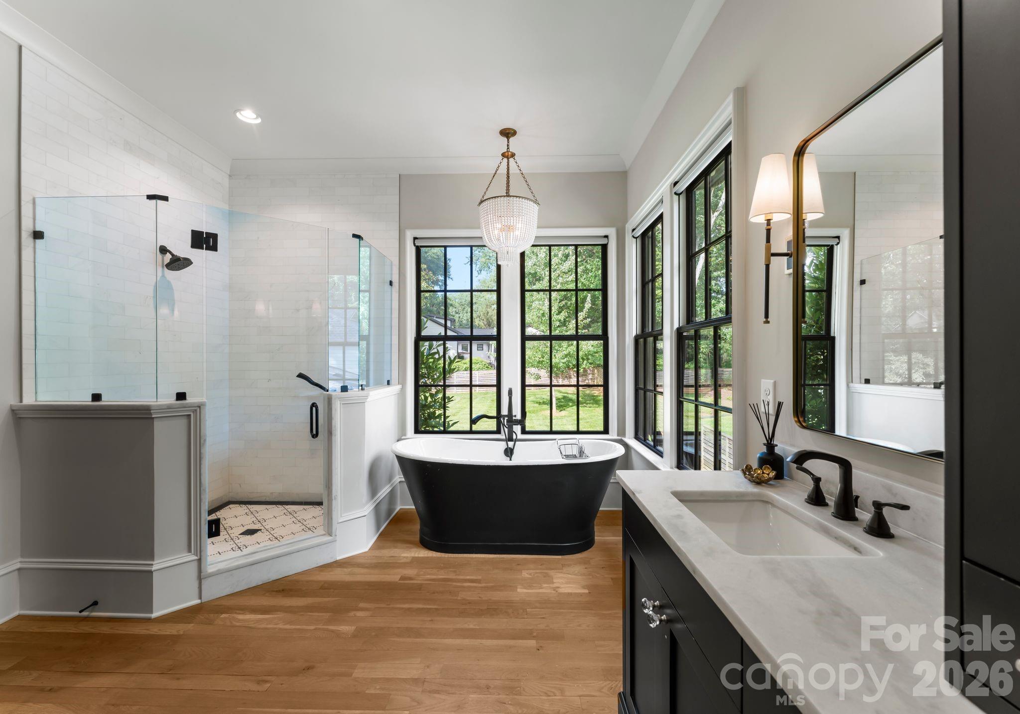 5625 Timber Lane Charlotte, NC 28270 - Photo 17 of 48 a spacious bedroom with a large bed and a window
