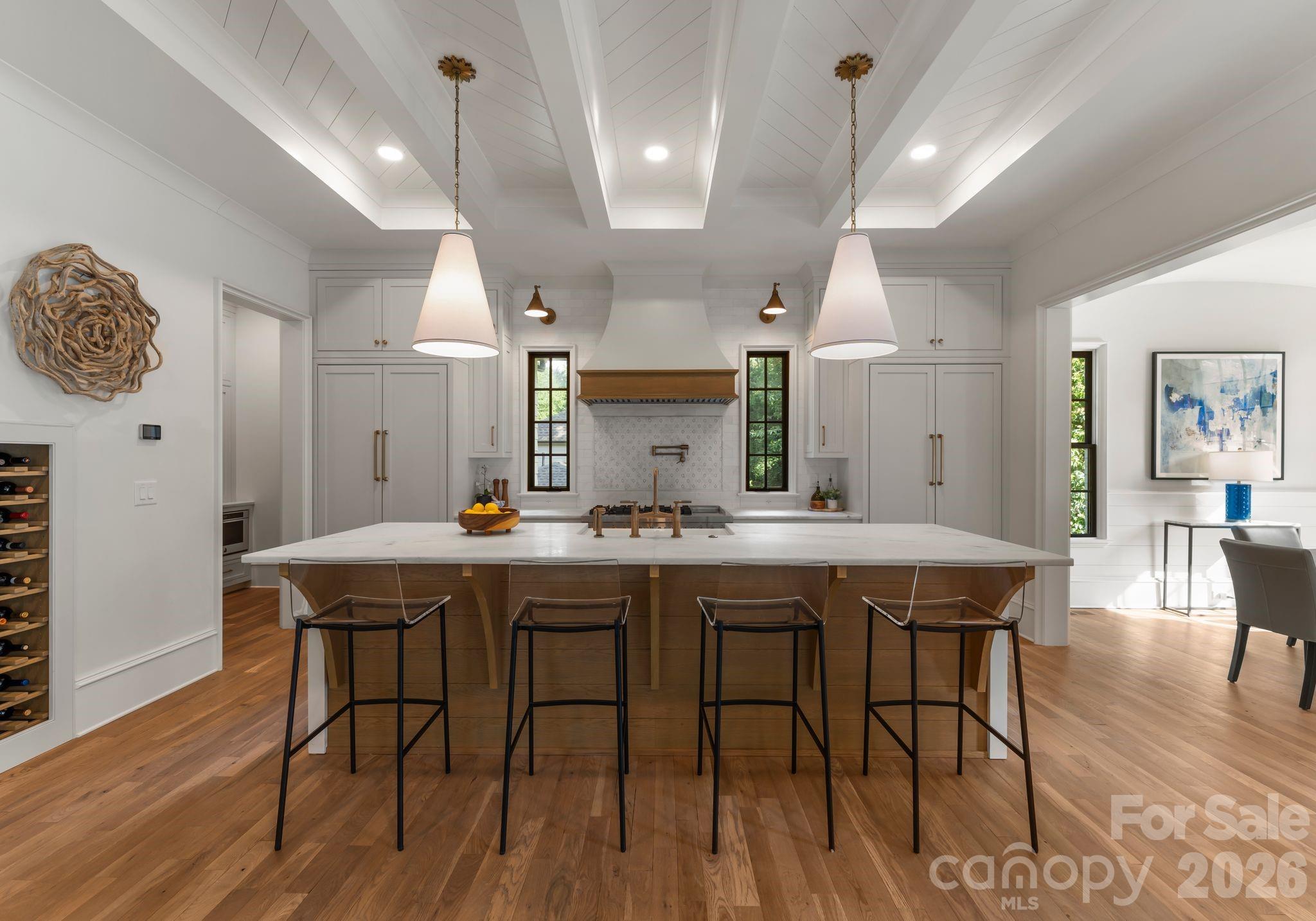 5625 Timber Lane Charlotte, NC 28270 - Photo 18 of 48 a kitchen with stainless steel appliances a dining table chairs and wooden floor