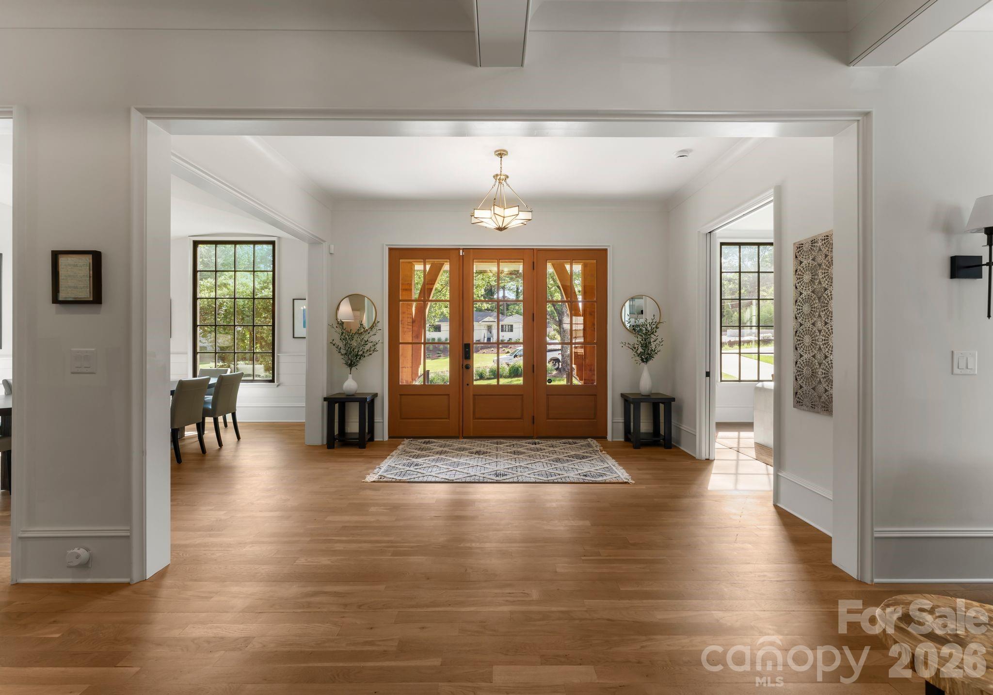 5625 Timber Lane Charlotte, NC 28270 - Photo 2 of 48 a view of an entryway with wooden floor and a living room
