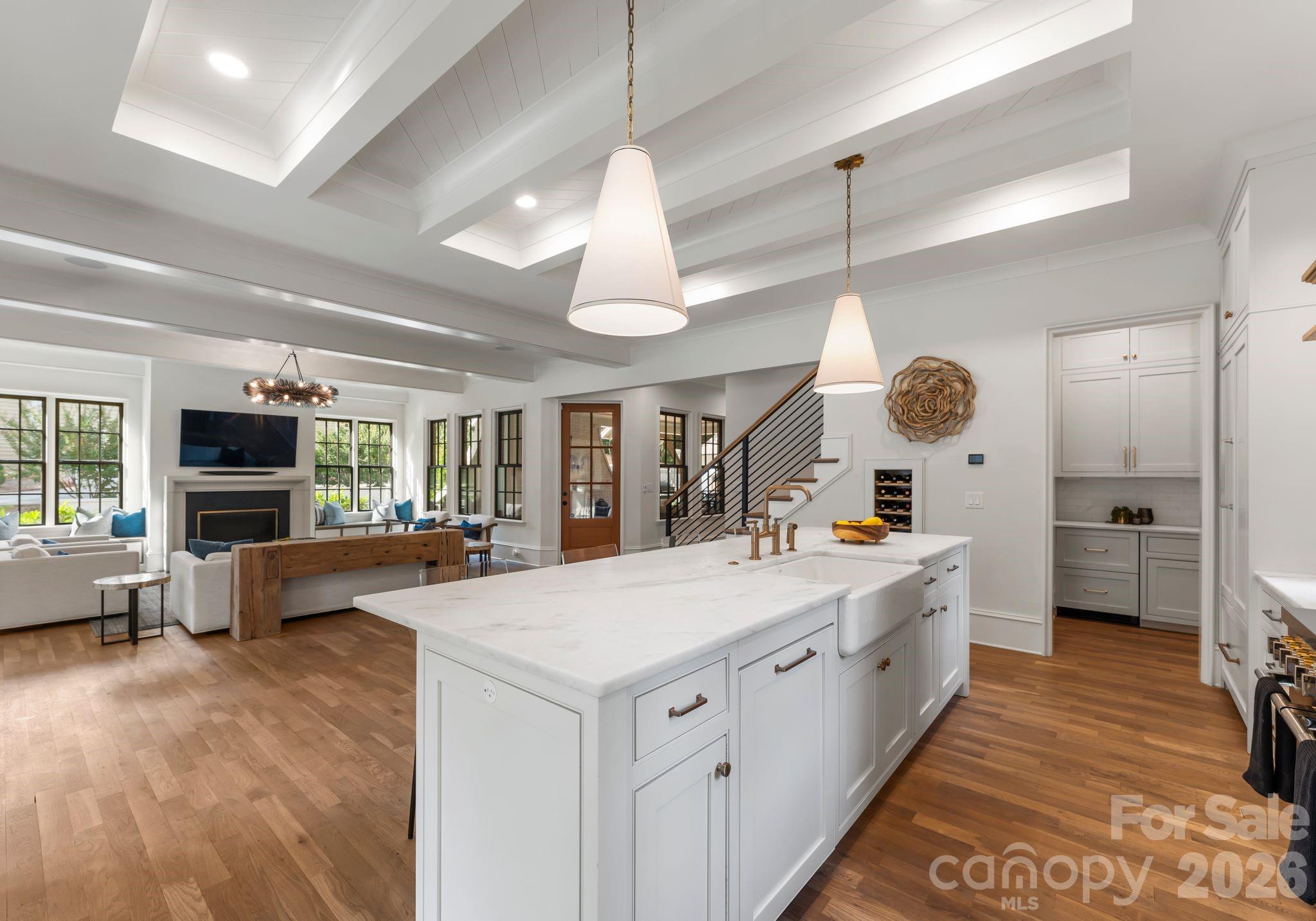 5625 Timber Lane Charlotte, NC 28270 - Photo 21 of 48 a large white kitchen with a large window a sink and stainless steel appliances