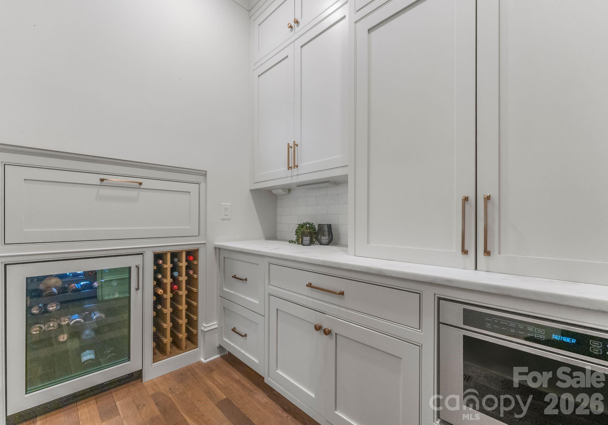 5625 Timber Lane Charlotte, NC 28270 - Photo 23 of 48 a kitchen with white cabinets and a stove