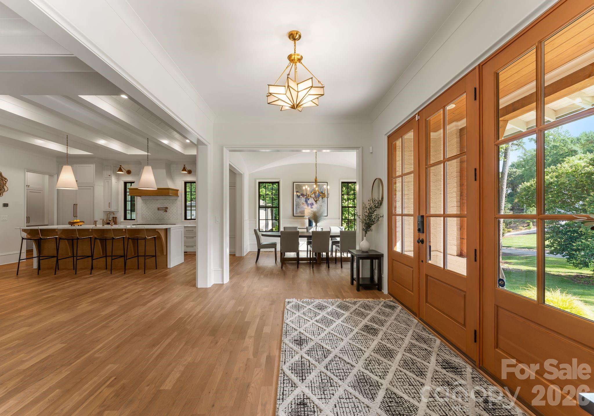 5625 Timber Lane Charlotte, NC 28270 - Photo 3 of 48 a living room with furniture a dining table and a large window
