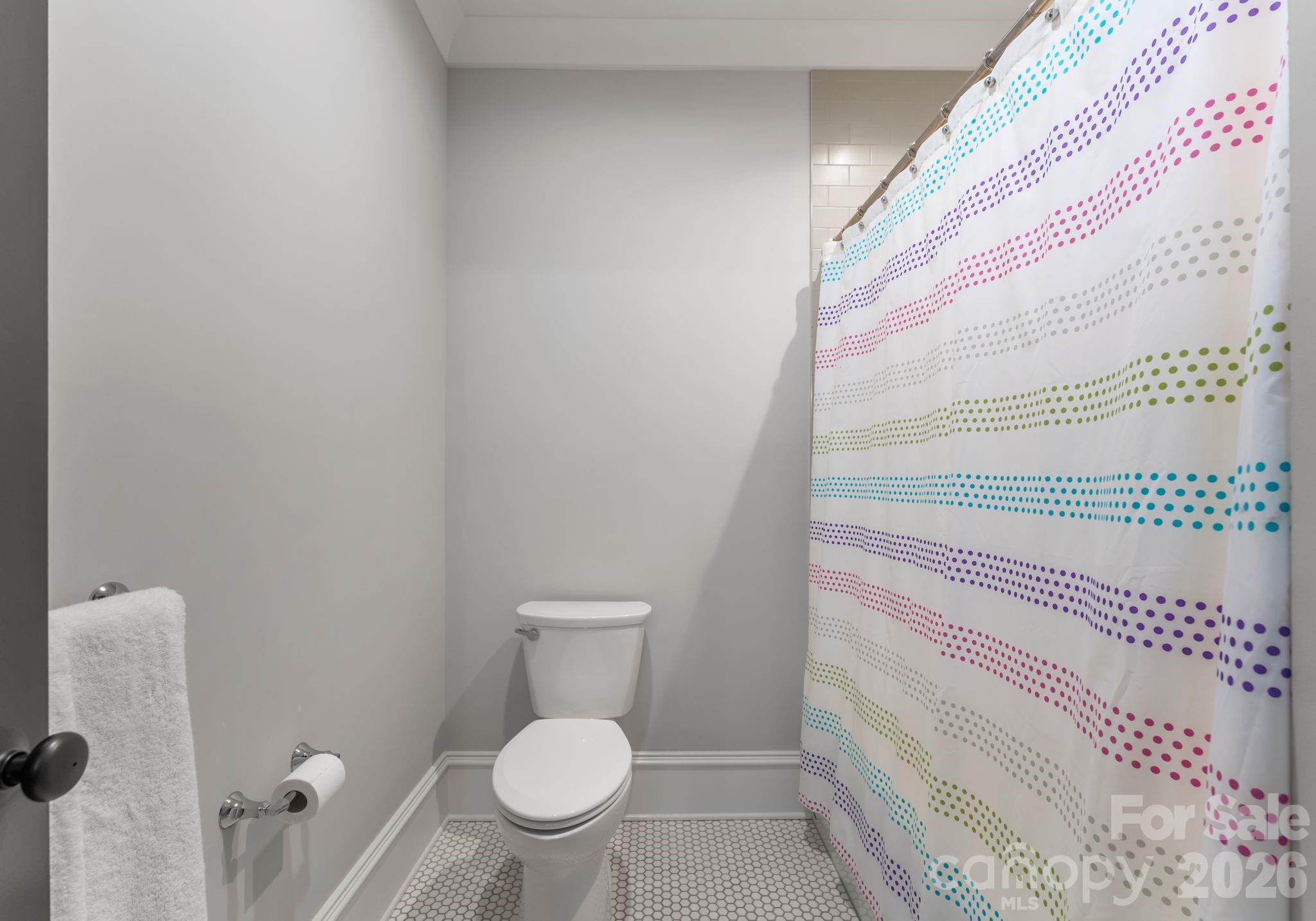 5625 Timber Lane Charlotte, NC 28270 - Photo 35 of 48 a bathroom with a toilet and a shower