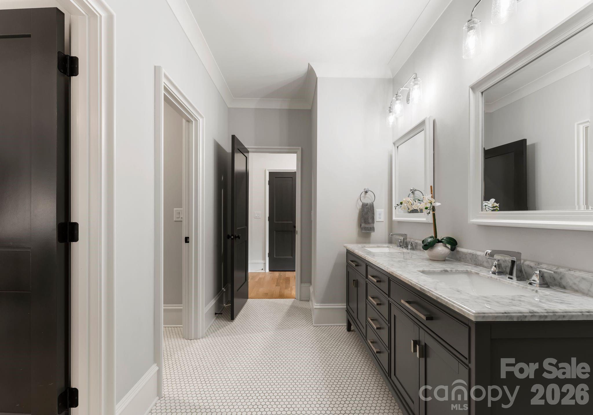 5625 Timber Lane Charlotte, NC 28270 - Photo 37 of 48 a spacious bathroom with a granite countertop double vanity sink and a mirror