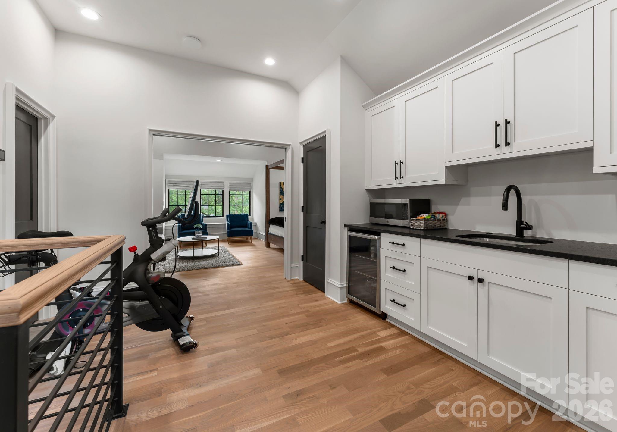 5625 Timber Lane Charlotte, NC 28270 - Photo 38 of 48 a kitchen with sink refrigerator and cabinets