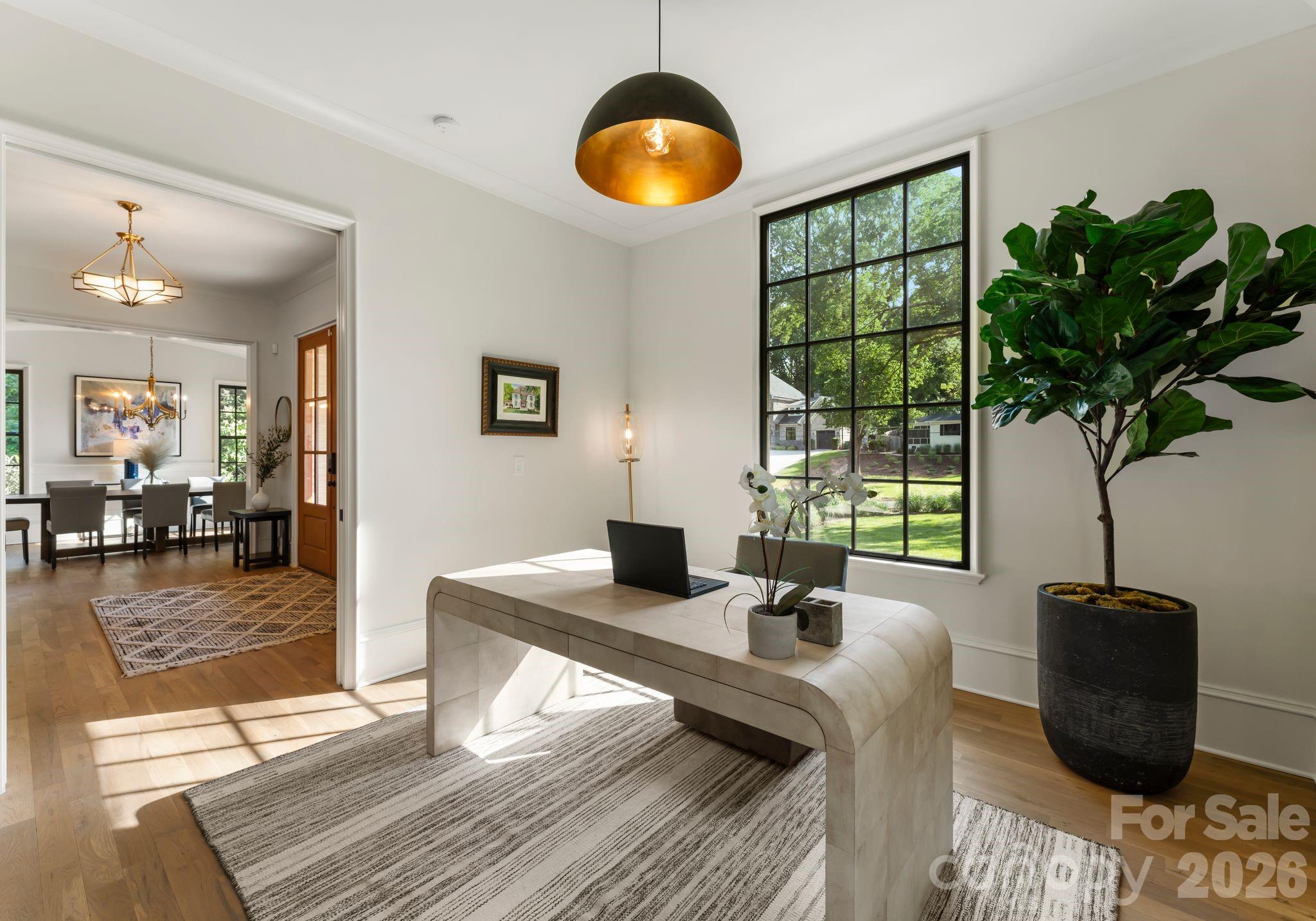 5625 Timber Lane Charlotte, NC 28270 - Photo 4 of 48 a living room with furniture and a potted plant