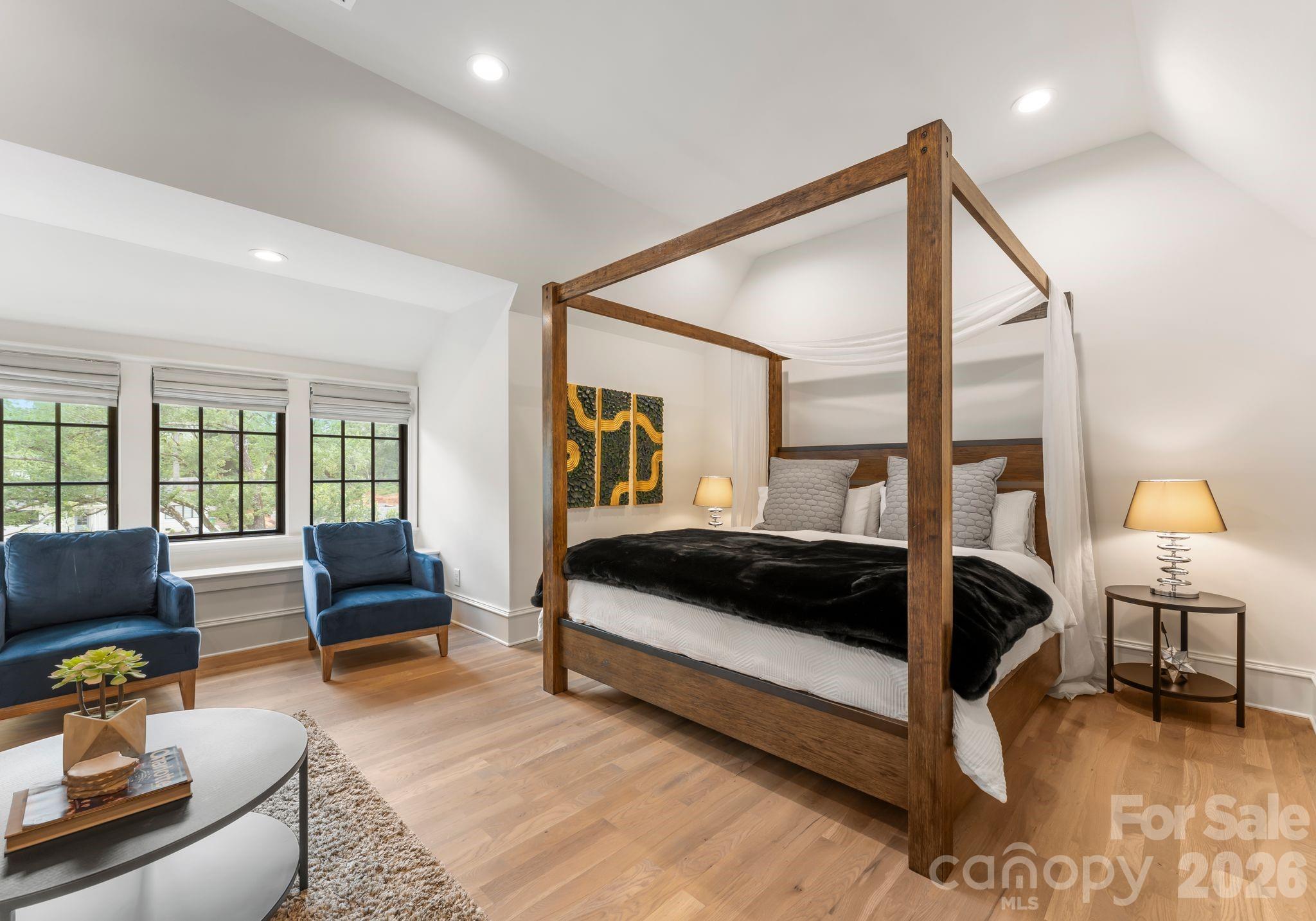 5625 Timber Lane Charlotte, NC 28270 - Photo 41 of 48 a bedroom with a bed a couch and a dresser next to a window