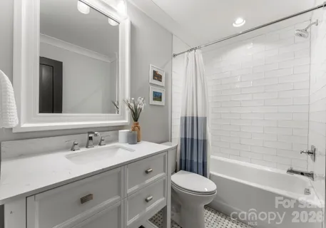 a bathroom with a sink toilet tub and shower