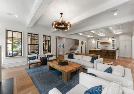 a living room with furniture or couch and a large window