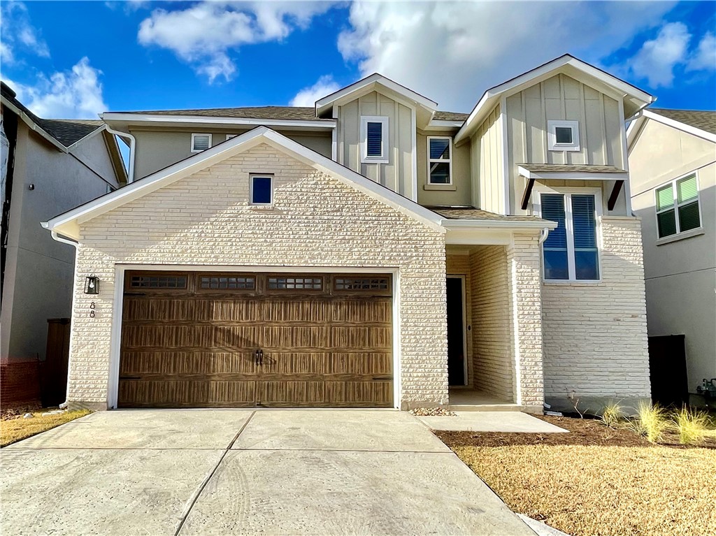 600 C-Bar Ranch Trail, Unit 88 Cedar Park, TX 78613 - Photo 1 of 1 a front view of a house with a yard and garage
