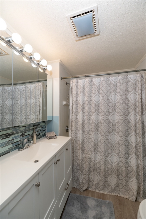 63 North Ridge Road Ipswich, MA 01938 - Photo 16 of 28 a bathroom with a sink and a mirror
