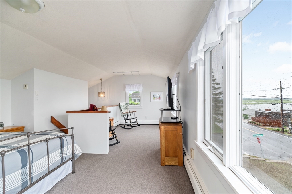 63 North Ridge Road Ipswich, MA 01938 - Photo 21 of 28 a living room with furniture and a large window