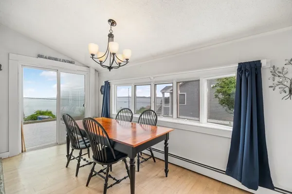 a view of a dining room with furniture window and outside view
