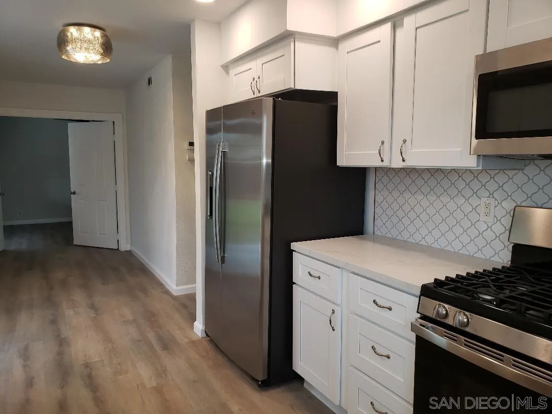 1859 Rees Road San Marcos, CA 92069 - Photo 3 of 11 a kitchen with cabinets and steel stainless steel appliances