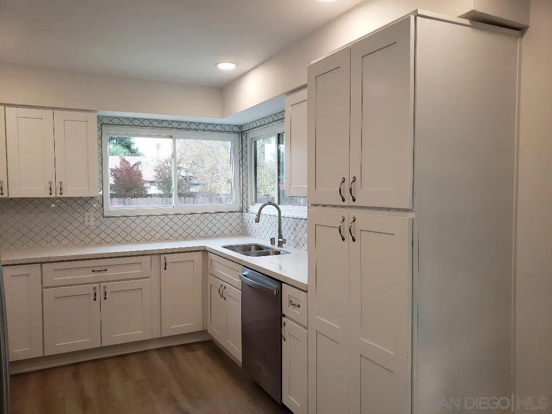 1859 Rees Road San Marcos, CA 92069 - Photo 5 of 11 a kitchen with a sink cabinets appliances and a window