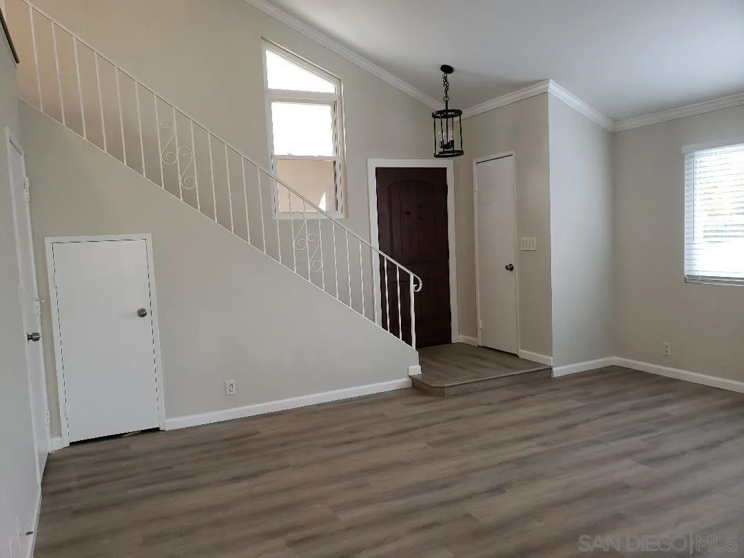 1859 Rees Road San Marcos, CA 92069 - Photo 6 of 11 a view of an empty room with wooden floor and a window