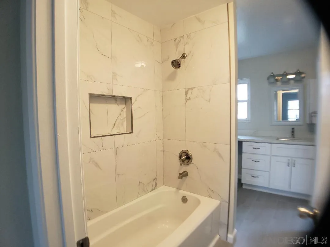 1859 Rees Road San Marcos, CA 92069 - Photo 8 of 11 a bathroom with a bathtub and a sink