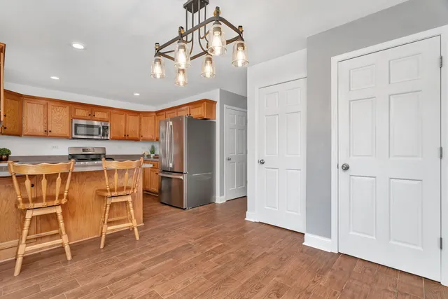 a bathroom with a sink vanity mirror and toilet