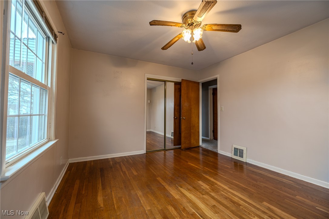 765 Pendley Road Willowick, OH 44095 - Photo 48 of 50 Unfurnished bedroom featuring a closet, ceiling fan, and dark hardwood / wood-style floors