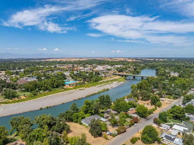 an aerial view of city and lake