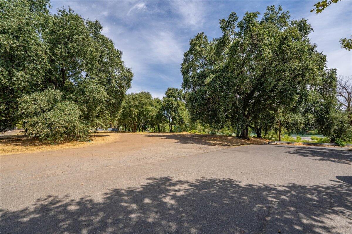 426 Riverside Way Red Bluff, CA 96080 - Photo 3 of 22 a view of a road with a yard