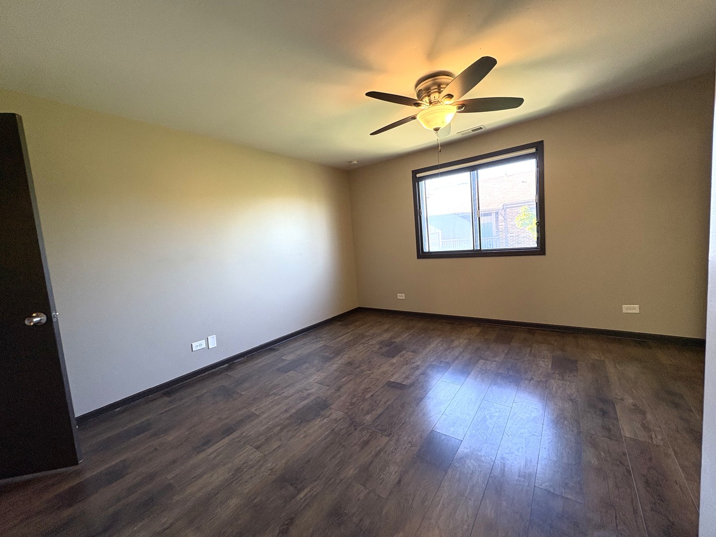 15805 Peggy Lane, Unit 9 Oak Forest, IL 60452 - Photo 11 of 20 a view of empty room with wooden floor and fan