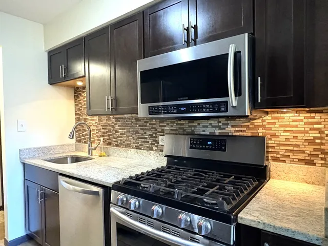 a kitchen with a stove and a microwave