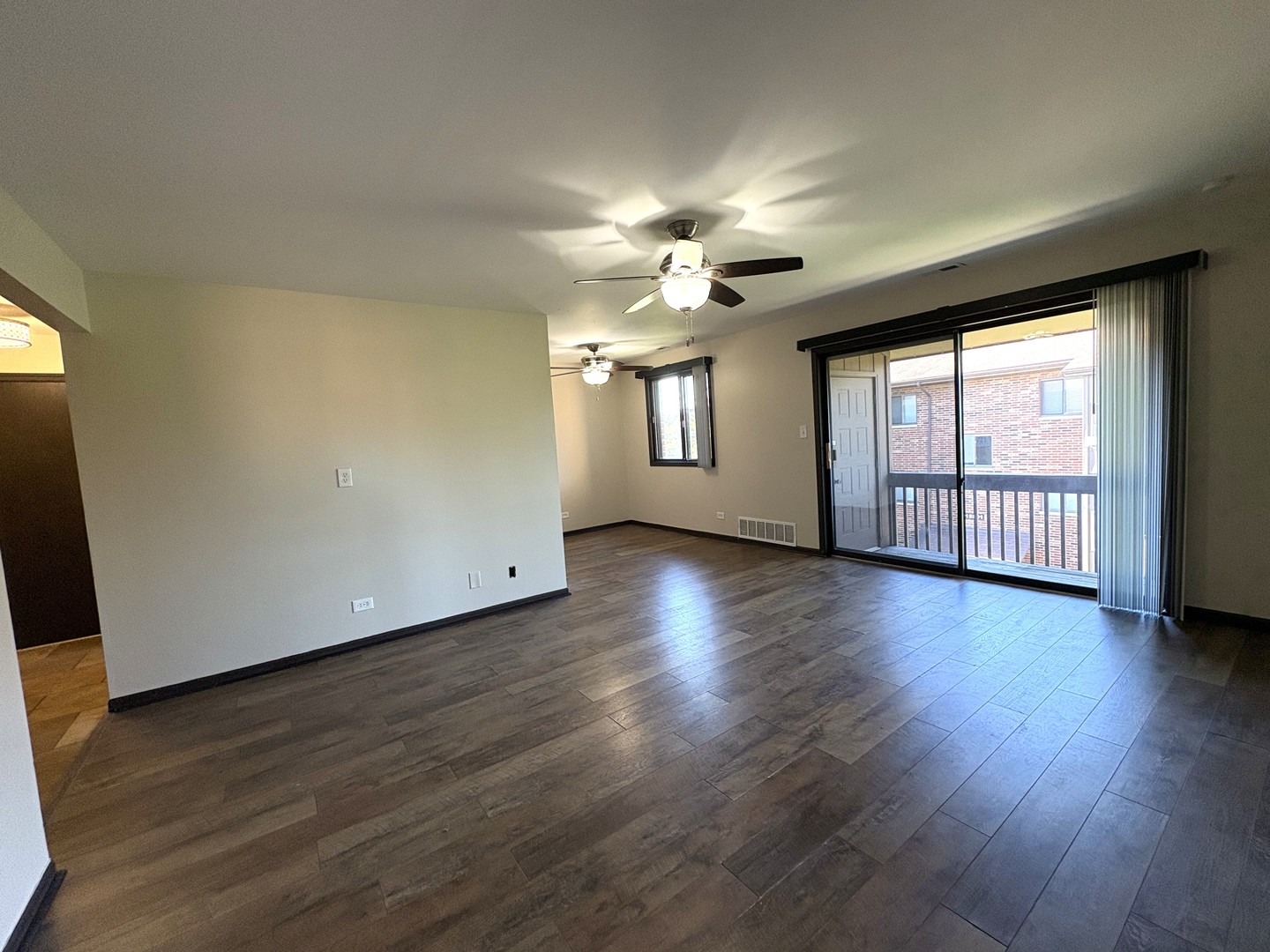 15805 Peggy Lane, Unit 9 Oak Forest, IL 60452 - Photo 9 of 20 an empty room with wooden floor and windows