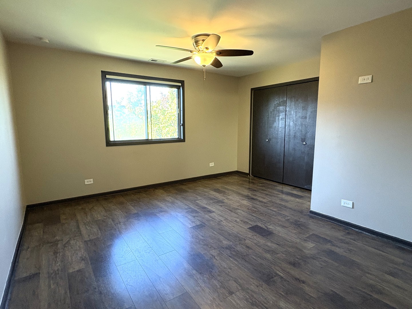 15805 Peggy Lane, Unit 9 Oak Forest, IL 60452 - Photo 10 of 20 a view of an empty room with wooden floor and a window