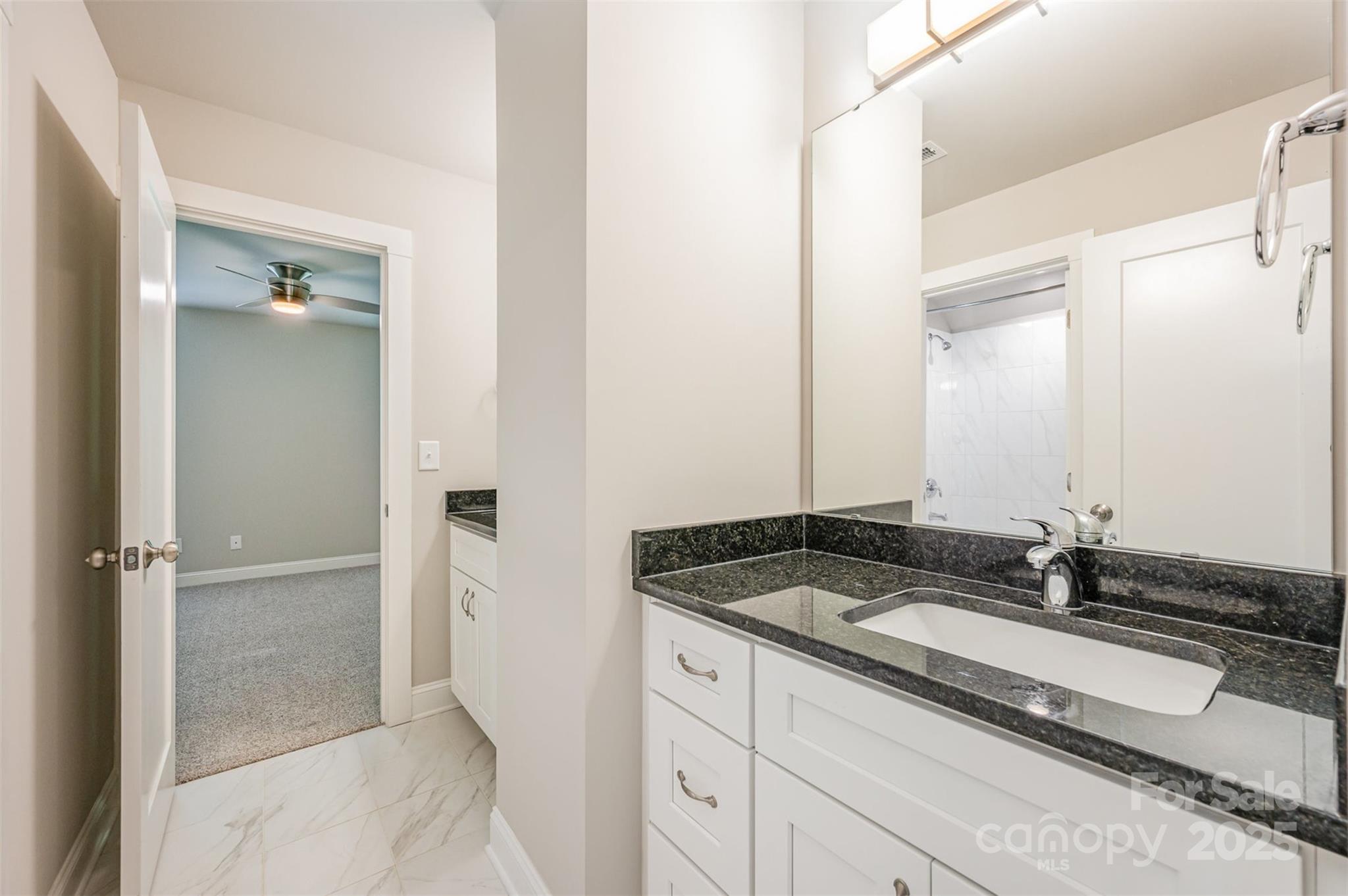 3004 Village Ridge Drive Gastonia, NC 28056 - Photo 24 of 35 a bathroom with a granite countertop sink and a mirror
