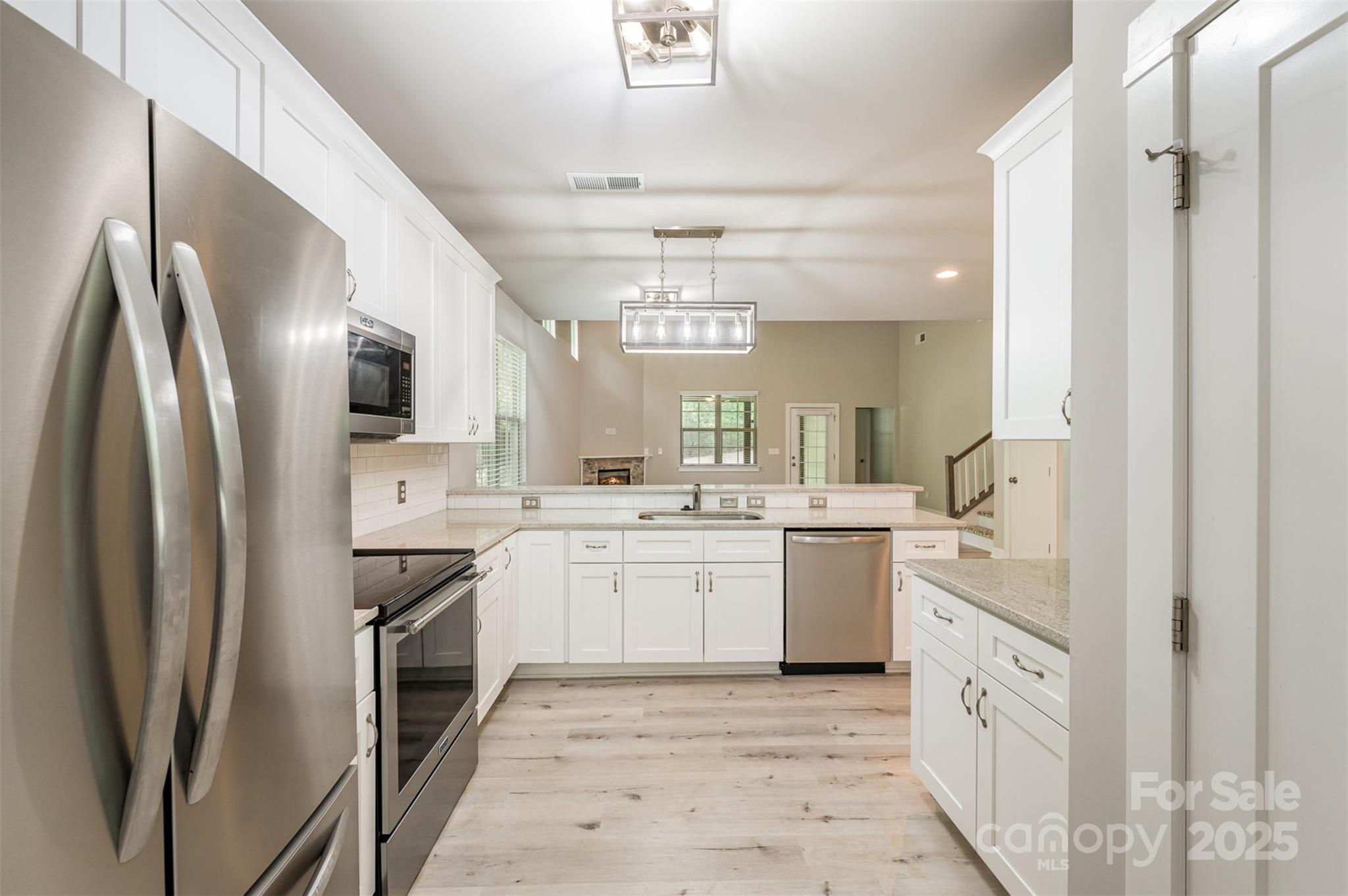 3004 Village Ridge Drive Gastonia, NC 28056 - Photo 7 of 35 a kitchen with cabinets and stainless steel appliances