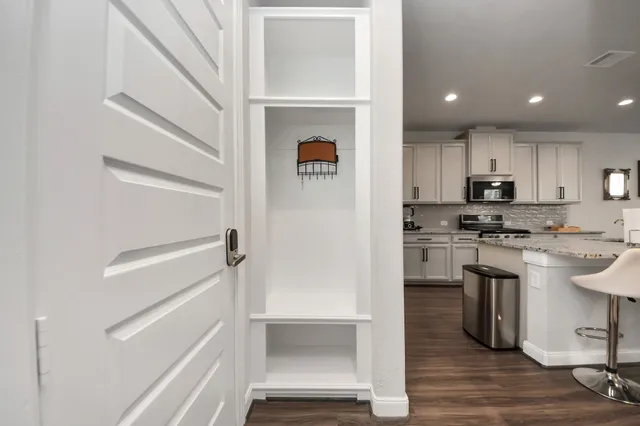 an empty room with a empty space and window