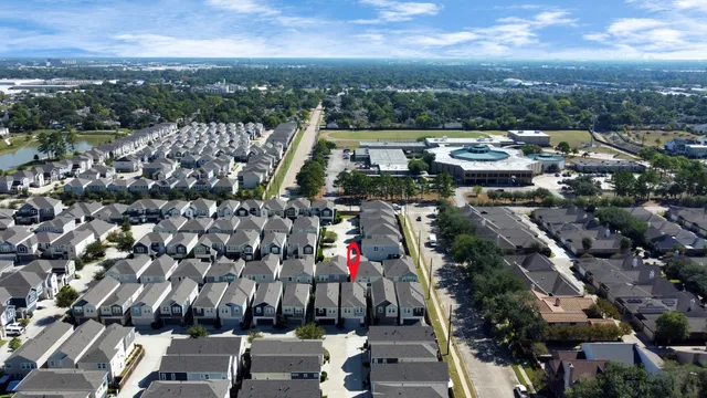 a front view of a house with a yard and a garage